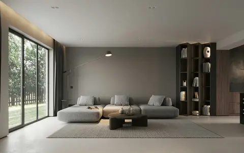 Minimal grey living room with low sofa and floor-to-ceiling glazing
