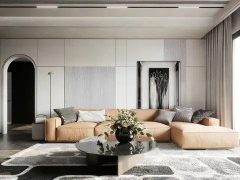 Warm lounge with a camel leather sectional and panelled walls