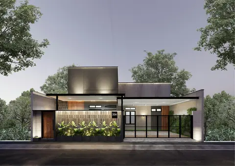 Modern house with concrete facade, timber accents and a black metal gate lit at dusk